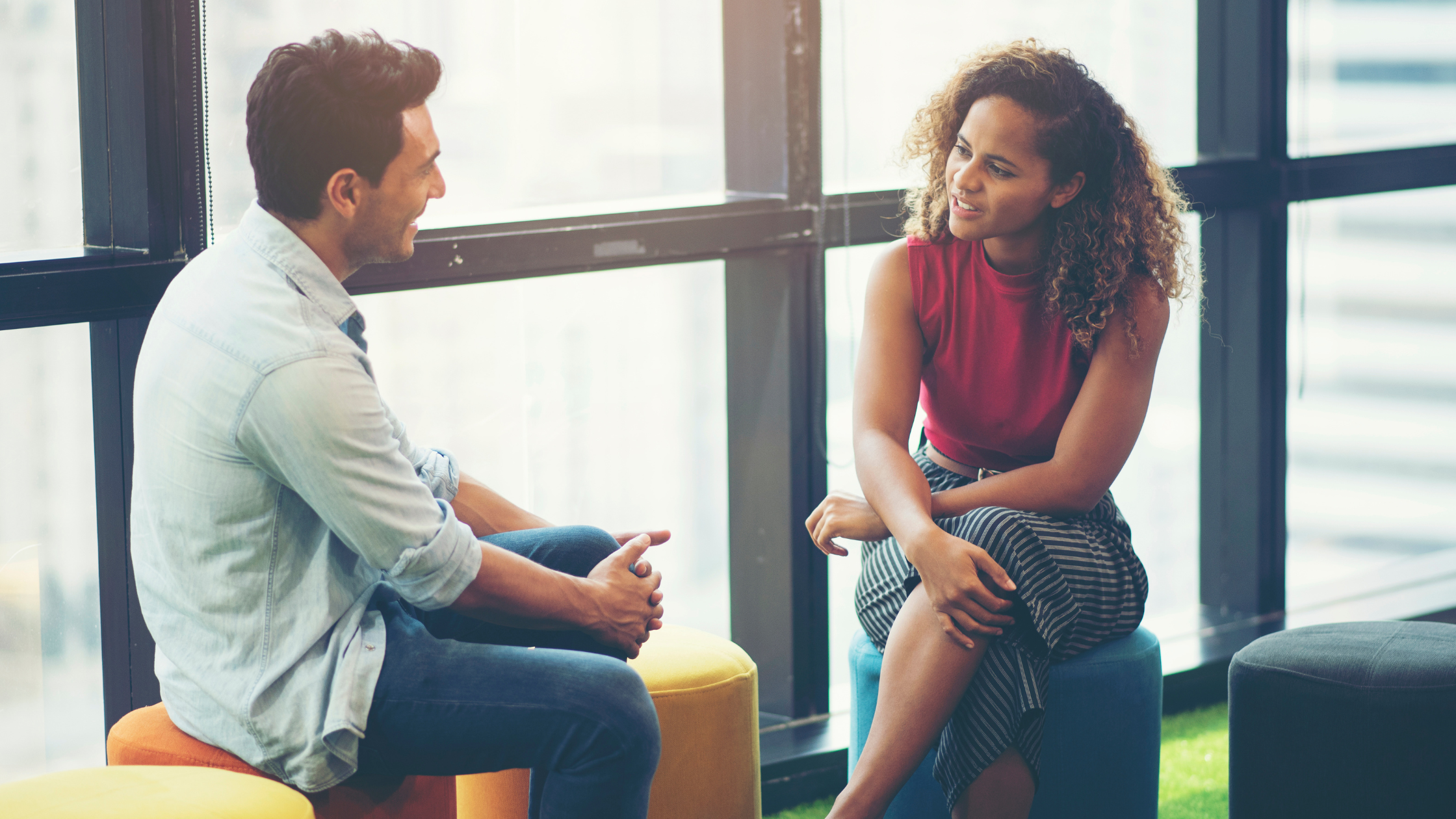 Two people having a conversation at work